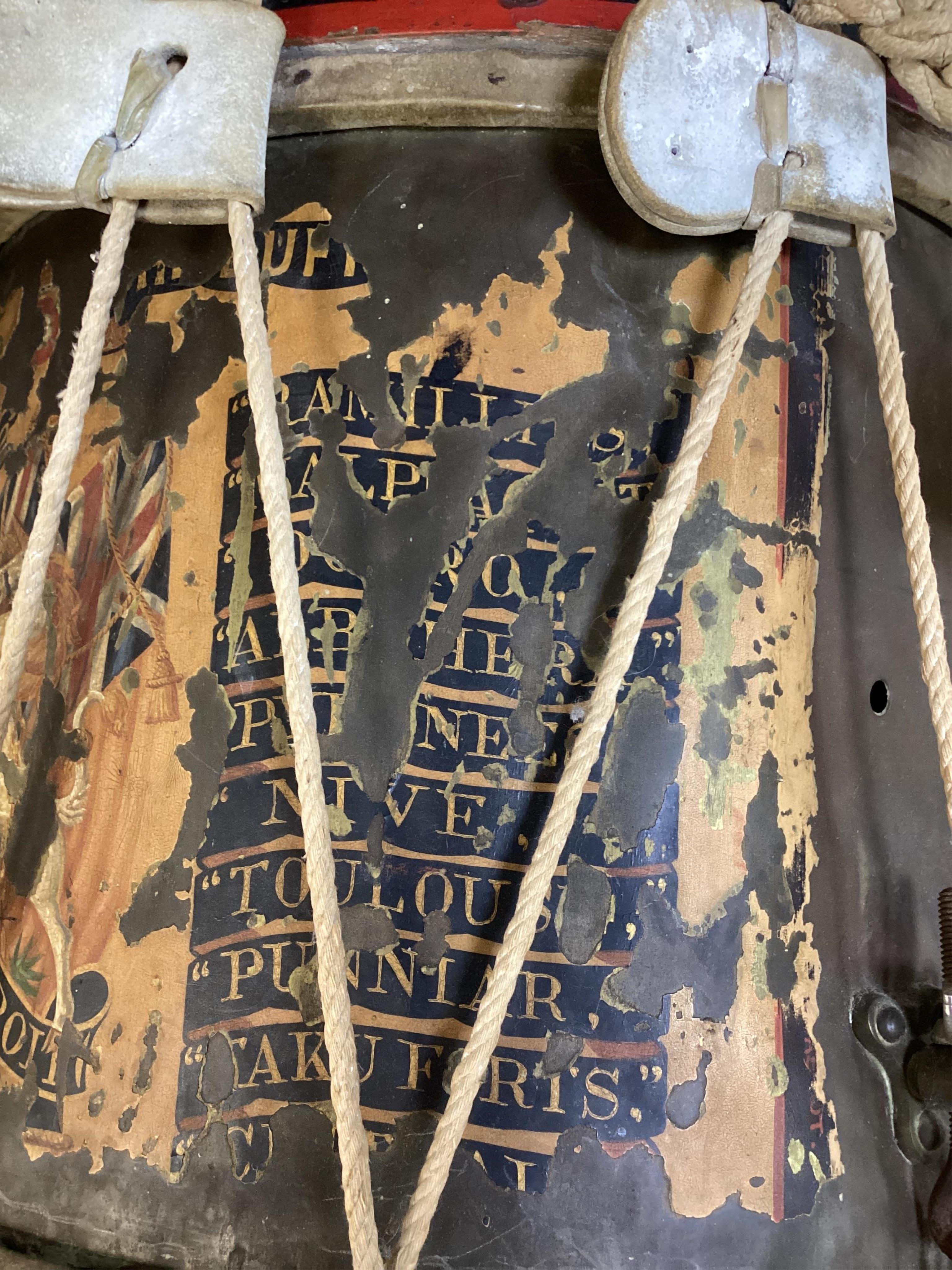 A late 19th/early 20th century Royal East Kent Regiment 'Buffs' regimental drum, 37cm diameter, 37cm high, together with a rope edged, stained pine removable 'table top' adaption